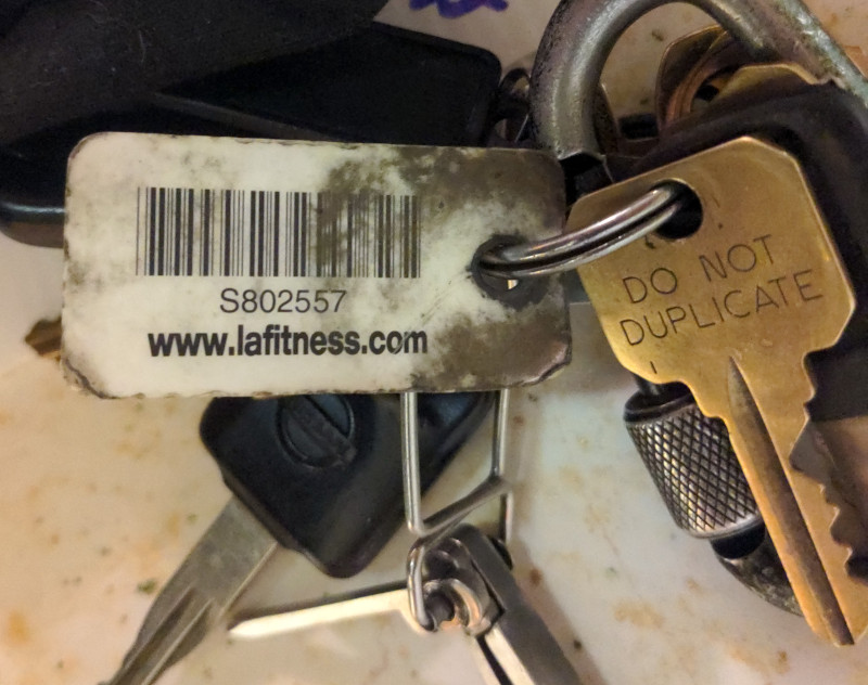 James Julius Johnson's keychain with an LA Fitness card, barcode with member number S802557.