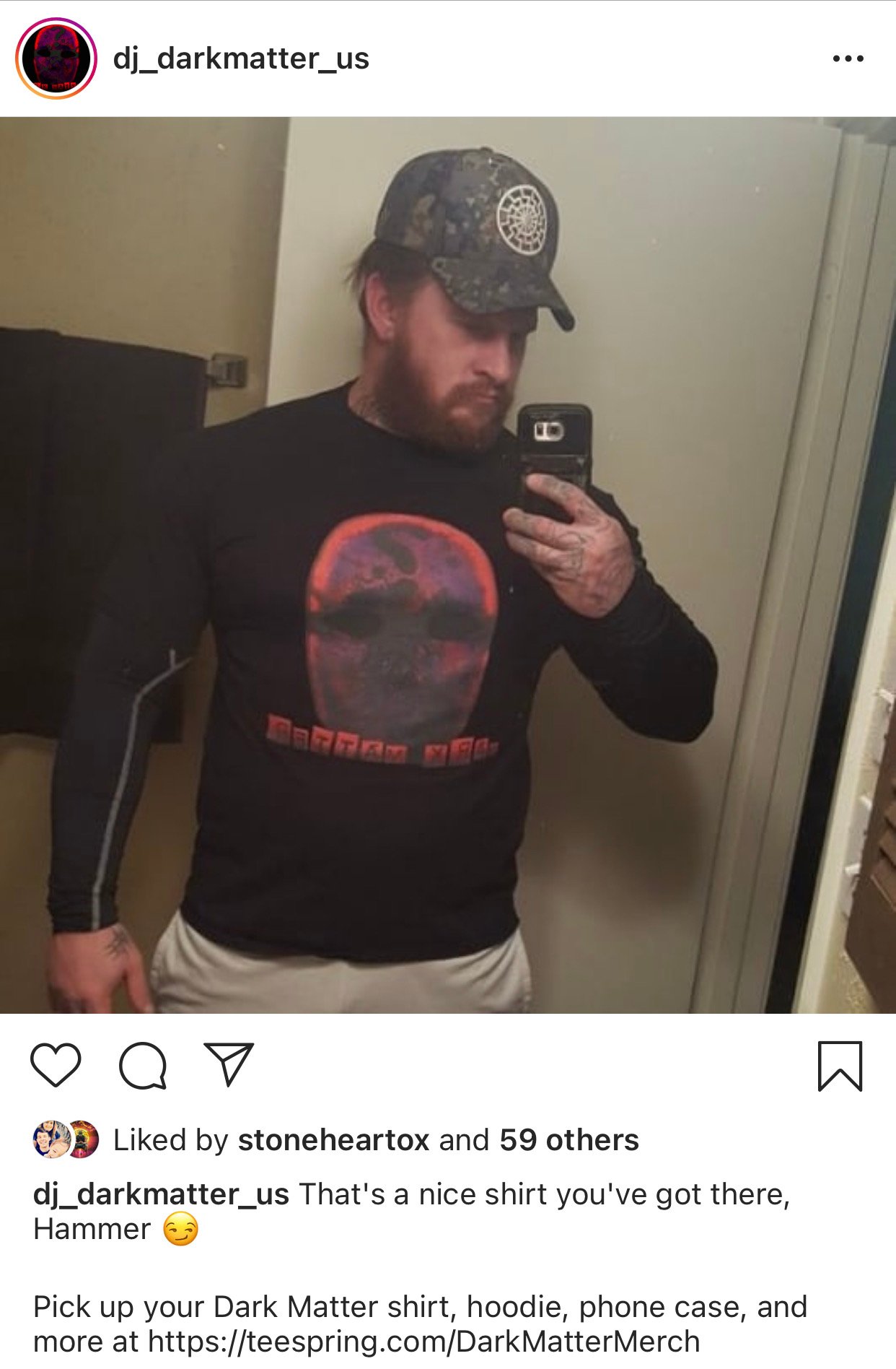 Christopher Pohlhaus wearing a DJ Dark Matter T-shirt.